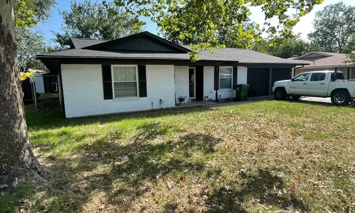 Professional roofing crew working on a residential roof in Orange Park